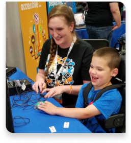 Two people smiling while playing a game.